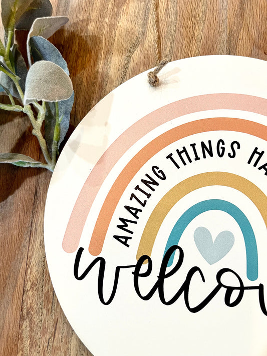 Welcome amazing things happen here hanging circle sign