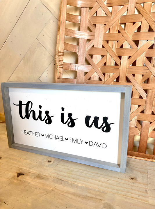 This is us listed family names with heart wood family sign