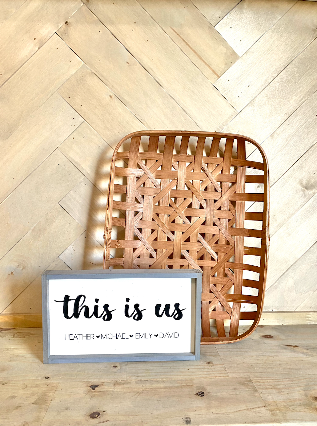 This is us listed family names with heart wood family sign