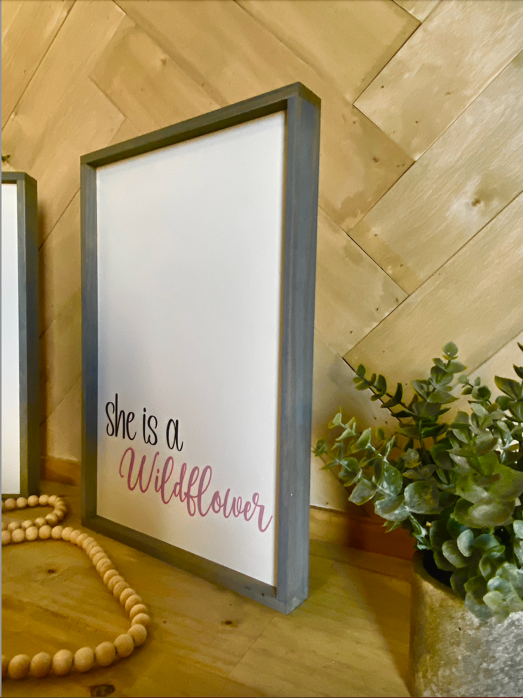 In a field of roses she is a wildflower pair of wood signs nursery signs