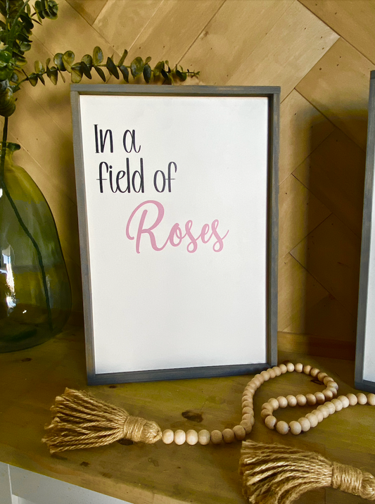 In a field of roses she is a wildflower pair of wood signs nursery signs