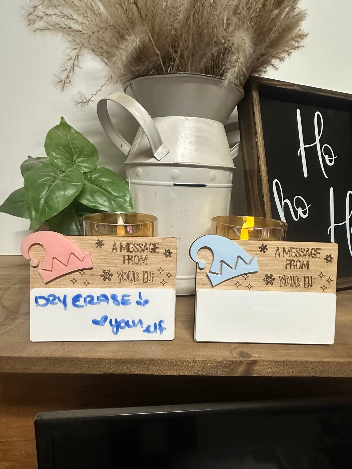 Pink and blue Message From Your Elf dry erase boards displayed together