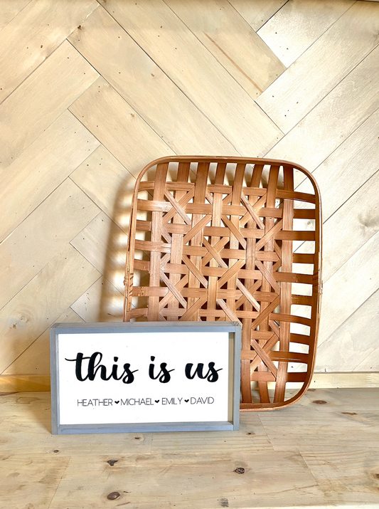 This is us listed family names with heart wood family sign