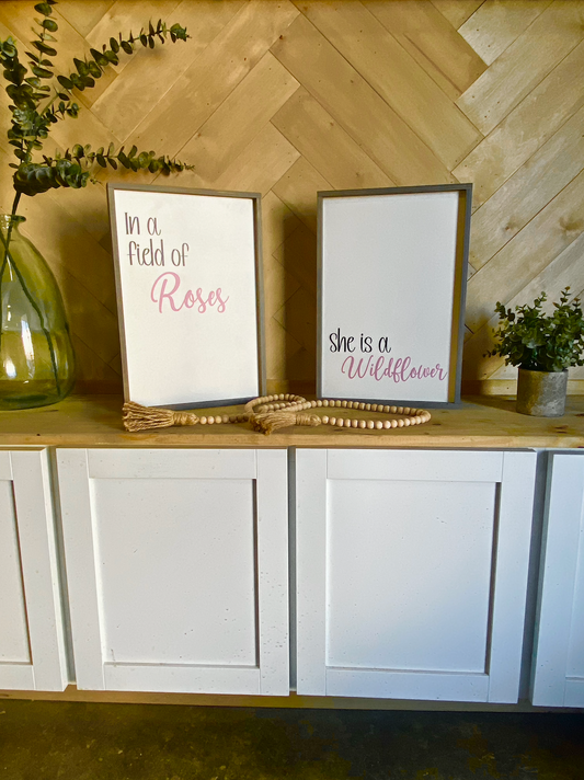 In a field of roses she is a wildflower pair of wood signs nursery signs