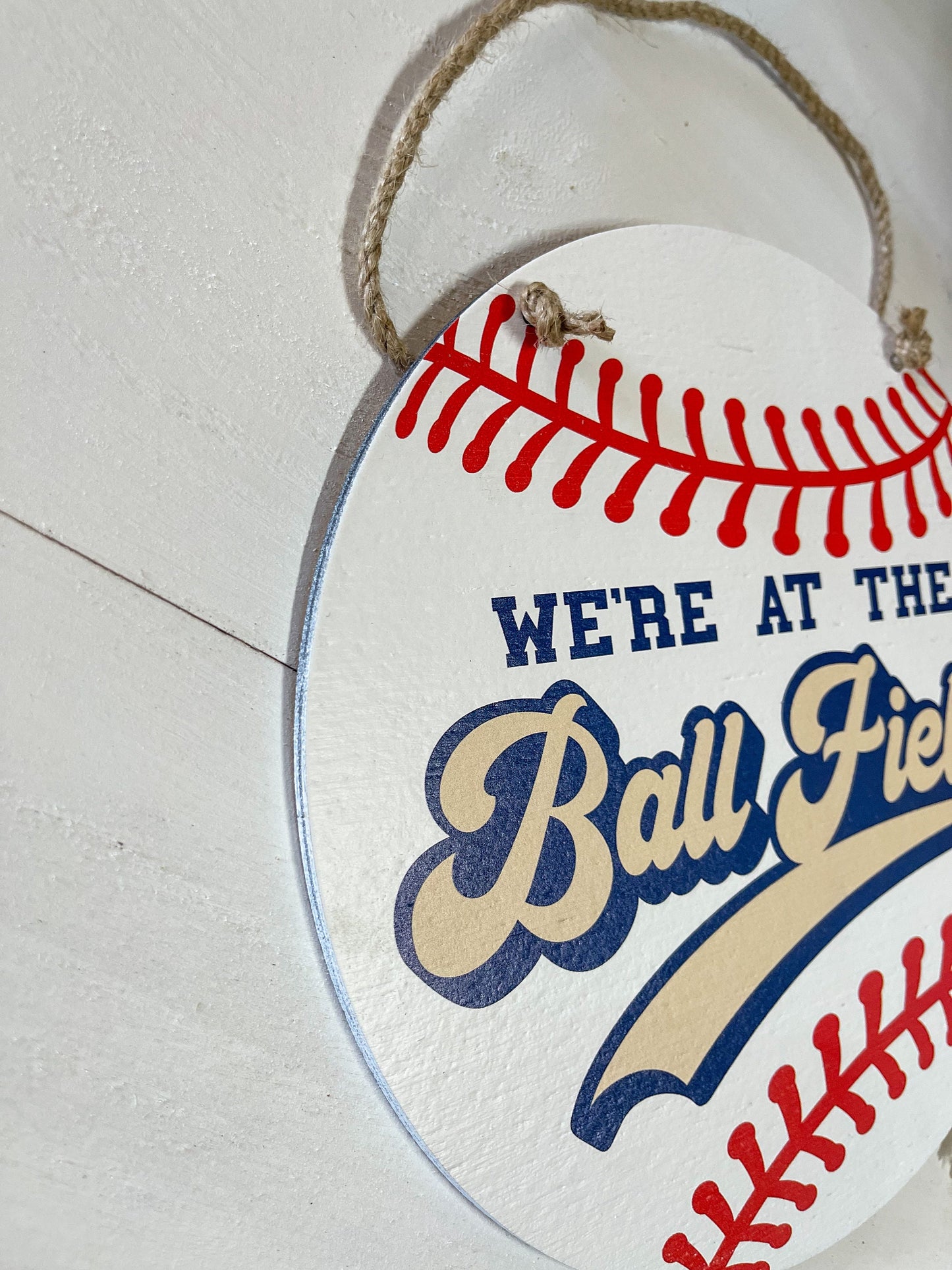 We're at the Ball field Round wood sign Baseball season welcome door hanger